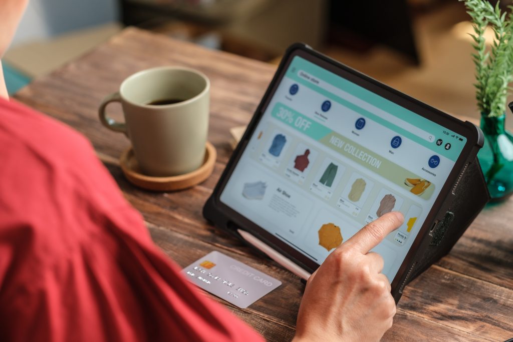 close-up-woman-hand-using-credit-card-shopping-online