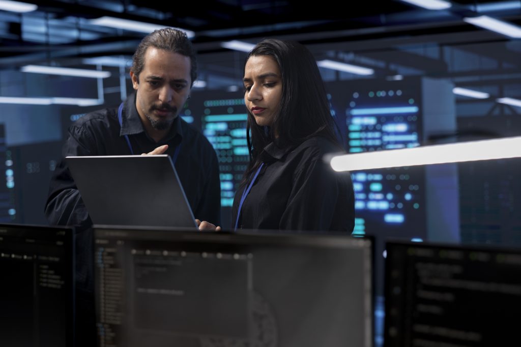 coworkers-in-data-center-doing-routine-disk-checks
