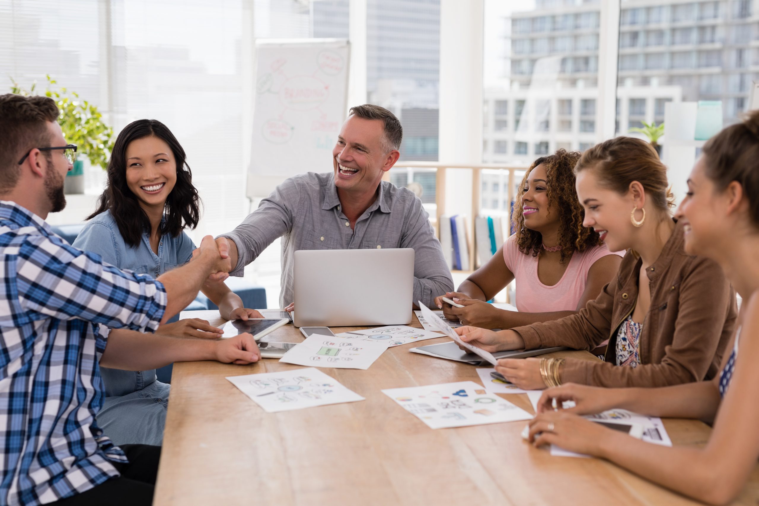 executives-shaking-hands-in-the-meeting