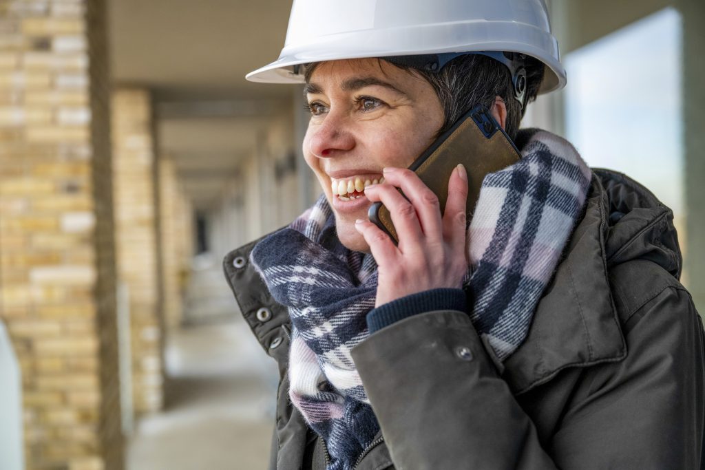 female-construction-manager-walking-around-site