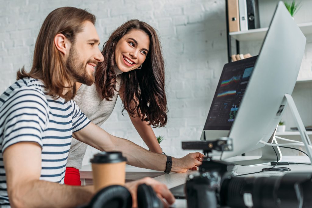 selective-focus-of-happy-art-editor-looking-at-com