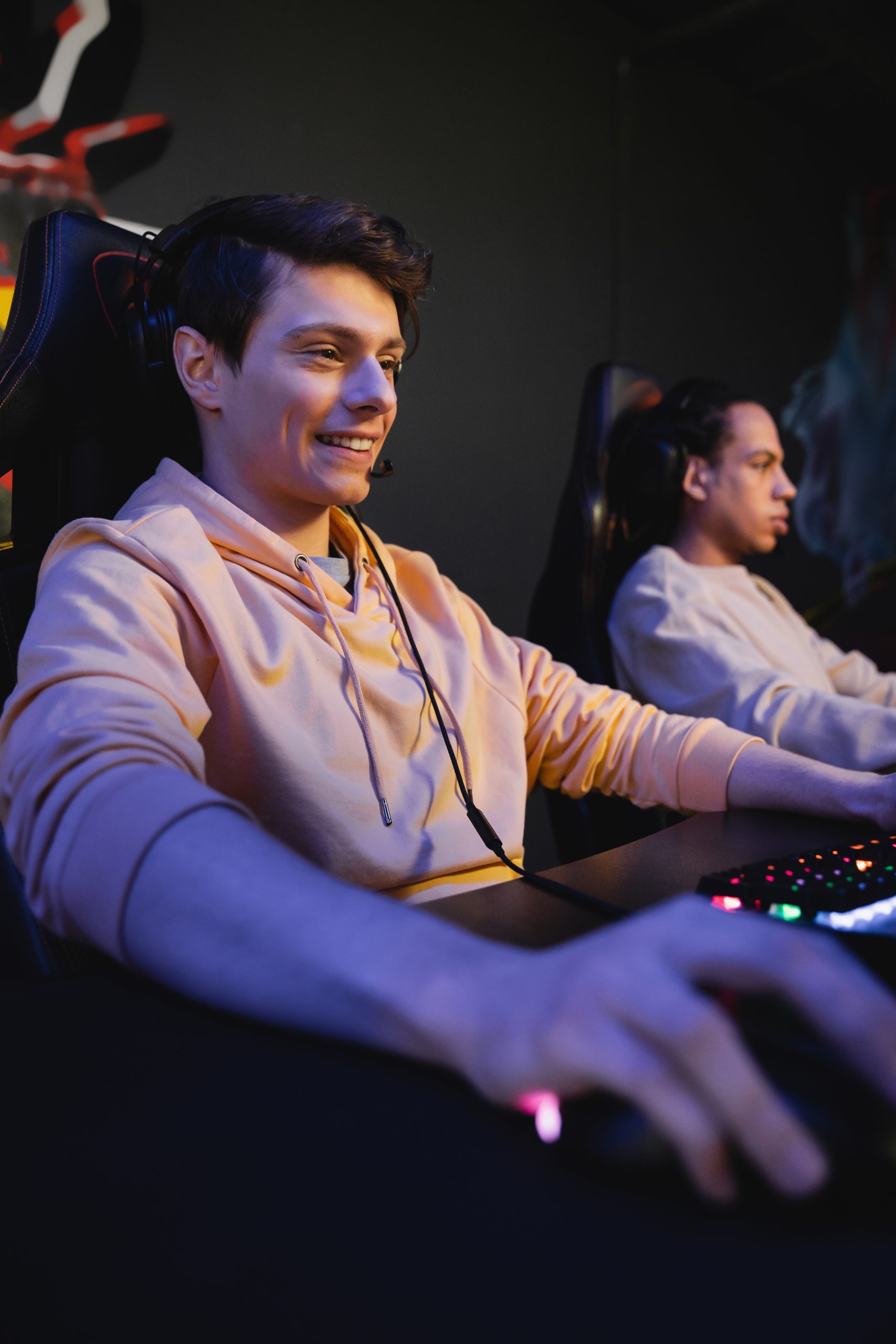 smiling player with headphones sitting